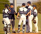 031819N02575 Coach Tony Degelia meets infield at mound t5 sm